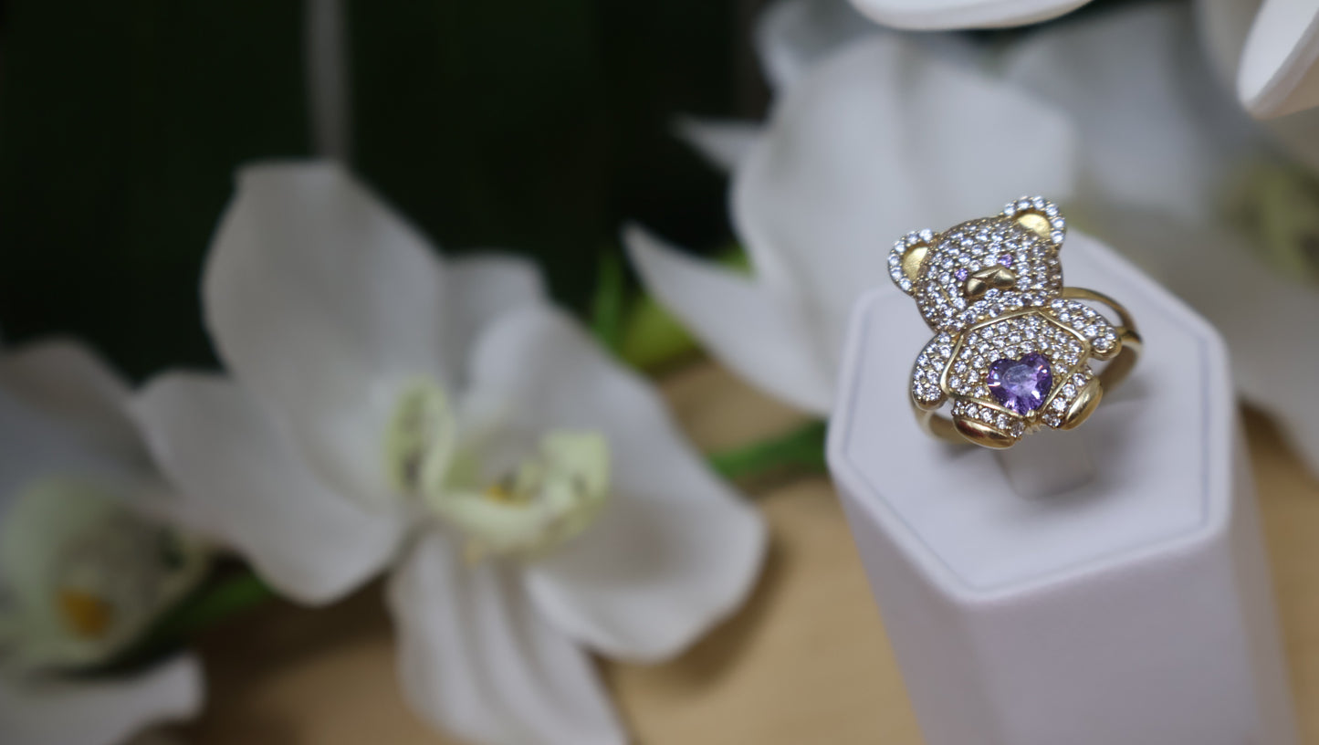 anillo de osito con circonia blanca y violeta en oro 10k