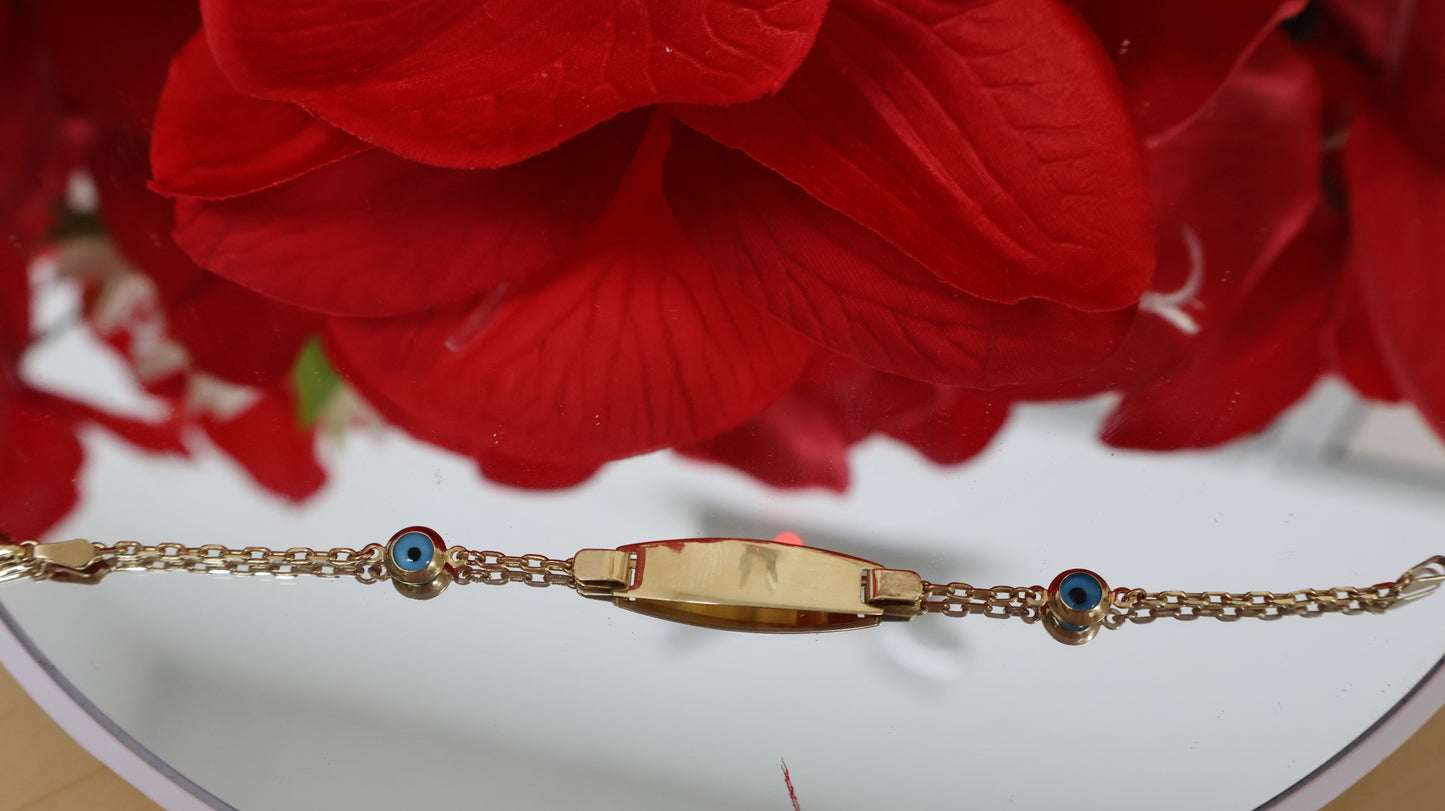 Manilla de nino con placa de ojitos en azul en oro de 14k