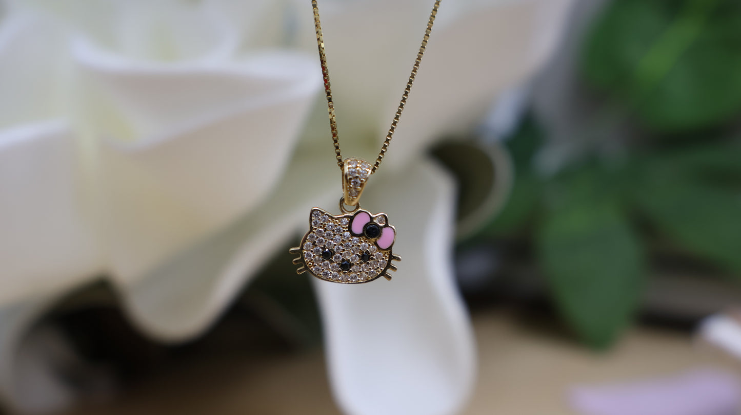 Conjunto de arete con la cadena y el dije de Hello Kitty en oro 10k