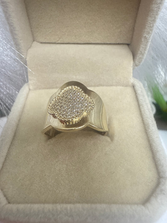 Anillo de mujer en oro 10k con circonia y una flor en el medio