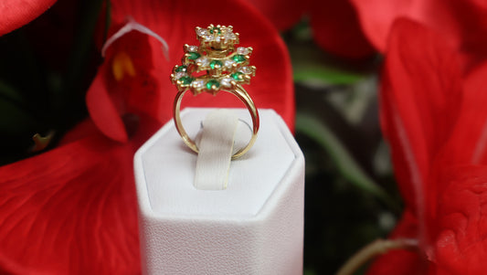anillo giratorio con sirconia verde y blanca en oro 10k