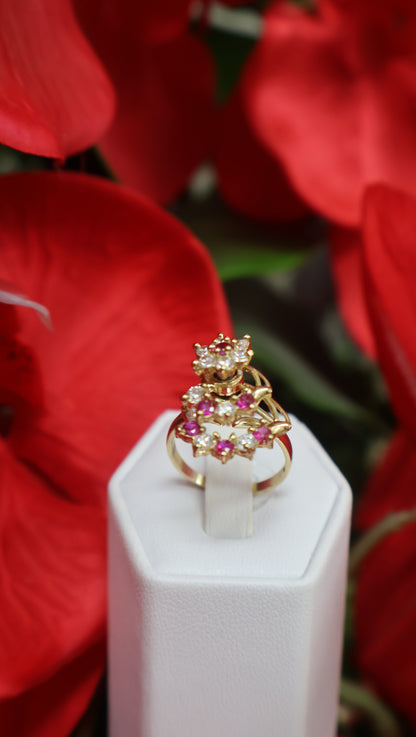 anillo de mujer  giratorio con sirconia de color  blanca y rosada en oro 10k