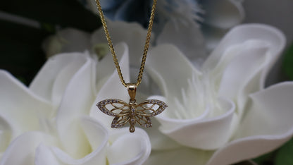 Dije de maripoza con circonia en  blanca de oro  10k