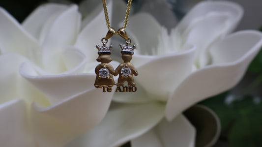 Dije de 10k pareja de nino con circonia en  blanca