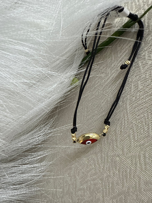 Manilla de ojito de color rojo y azul de coldon  , oro 14k